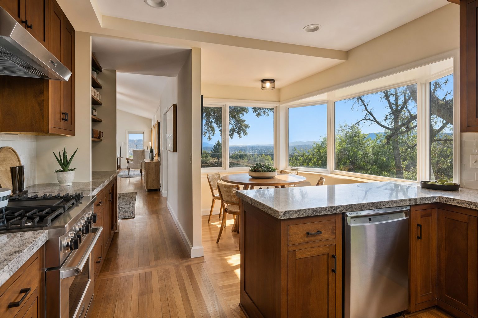 Updated kitchen interior with modern appliances, granite counters, and valley views in Granada Hills home.